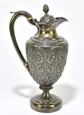 Lot 1050 - A Georgian hallmarked silver wine ewer, with...