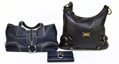 Lot 691 - COCCINELLE; an unused pebbled navy blue...