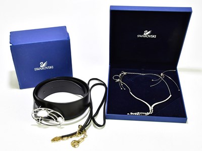 Lot 605 - SWAROVSKI; an unused black waist belt with...