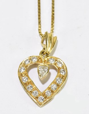 Lot 342 - A yellow metal and diamond heart shaped...