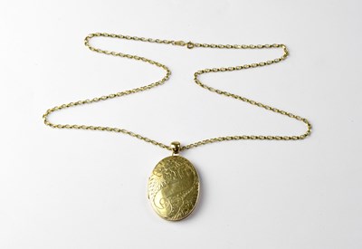 Lot 960 - A large 9ct gold oval double locket