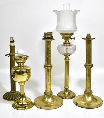 Lot 1205 - Five modern brass table lamps.