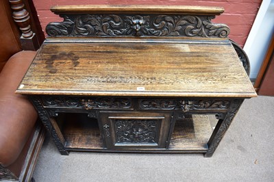 Lot 2355 - A late 19th century carved oak sideboard in...