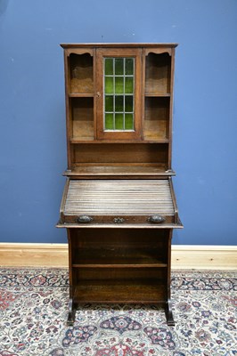 Lot 2354 - A late 19th/early 20th century oak roll top...