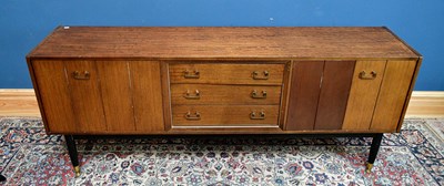 Lot 2563 - A mid century mahogany sideboard with three...