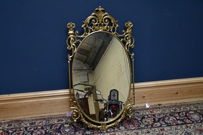Lot 2610 - A modern brass framed wall mirror with...