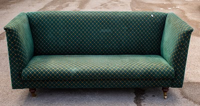 Lot 2379 - A green upholstered enclosed sofa on turned...