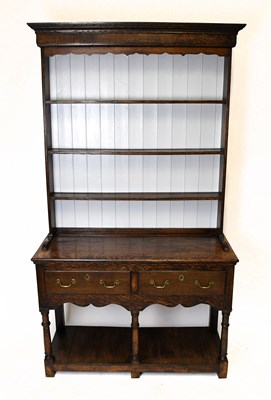 Lot 1480 - An 18th century style oak dresser, the raised...