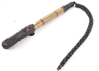 Lot 220 - An Eastern camel whip with leather and inlaid...