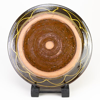 Lot 10 - CLIVE BOWEN (born 1943); a slipware dish...