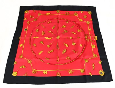 Lot 744 - HERMÈS; a 100% silk black, red and gold Clips...