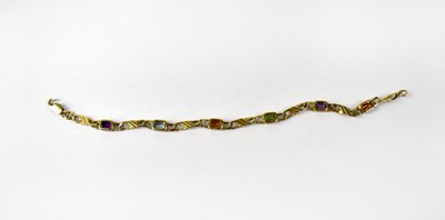 Lot 917a - A 9ct gold bracelet with six bezel set emerald cut gemstones