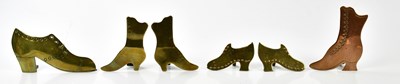 Lot 1393 - Two pairs of miniature brass boots, together...