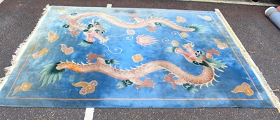 Lot 137 - A modern Chinese carpet with pair of Chinese...