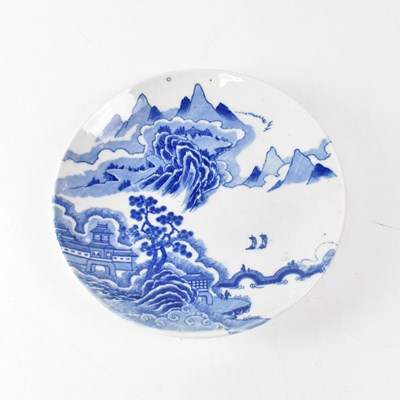 Lot 478 - An Oriental blue and white plate painted with...