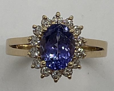 Lot 1158 - A 14ct yellow gold tanzanite and diamond oval...
