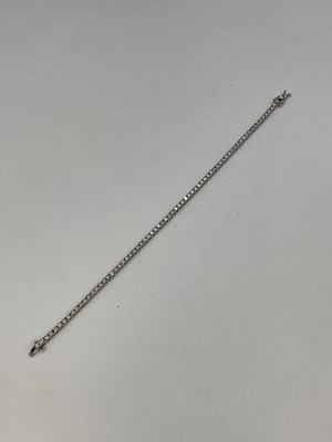 Lot 1151 - An 18ct white gold and diamond set tennis...