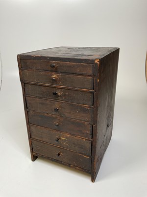 Lot 1294 - An early 20th century rustic seven drawer...
