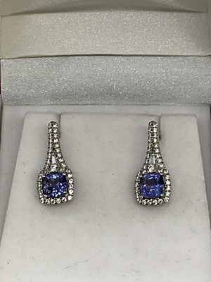 Lot 1162 - A pair of silver tanzanite and zirconia...