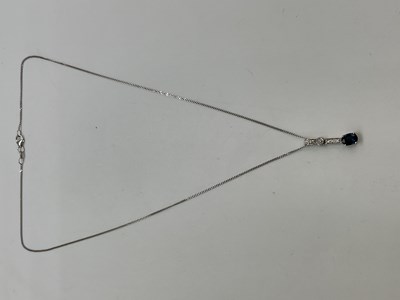 Lot 1165 - An 18ct white gold sapphire and diamond...