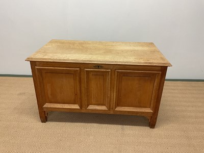 Lot 440 - A German light oak coffer with panelled detail,...