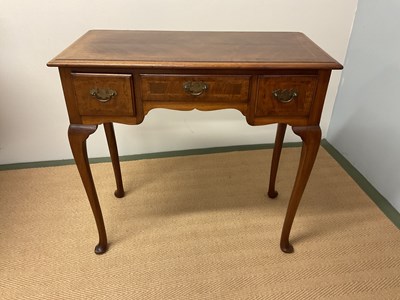 Lot 448 - An early 20th century lowboy table, with three...