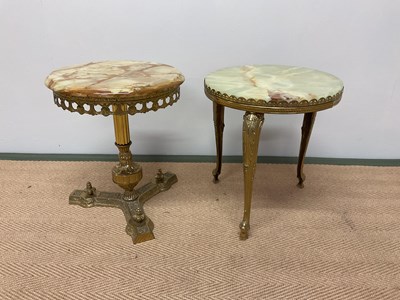 Lot 457 - Two 1970s brass and onyx side tables.