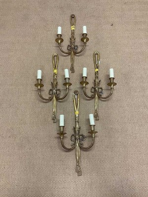 Lot 338 - Four gilt brass wall sconces in the form of...