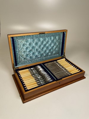 Lot 1117 - An early 20th century figured walnut cased set...