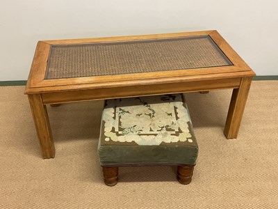 Lot 505 - An oak and rattan glass topped coffee table...