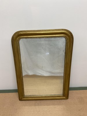 Lot 453 - A gilt framed overmantel mirror with beadwork...