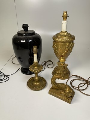 Lot 345 - Three gilt decorative lampbases and a black...