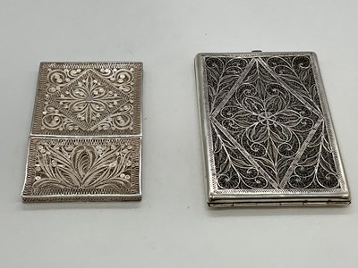 Lot 1114 - Two filigree decorated white metal card cases,...