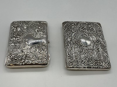 Lot 1035 - Two hallmarked silver leather lined card...