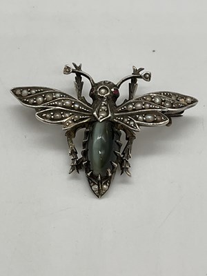 Lot 1276 - A white metal cultured pearl set insect brooch,...