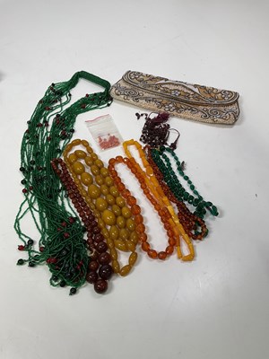 Lot 1282 - A small group of costume jewellery amber style...