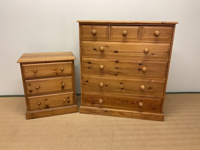 Lot 508 - A contemporary solid pine chest of three short...