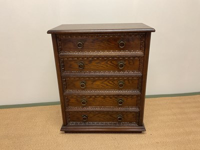 Lot 465 - An oak chest of five long drawers, height 74cm,...