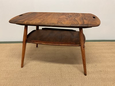 Lot 483 - ERCOL; a breakfast /coffee table with tapering...
