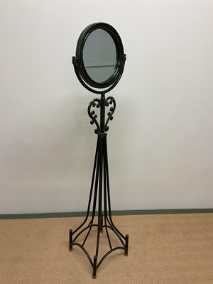 Lot 515 - A decorative mirror on a metal stand, height...