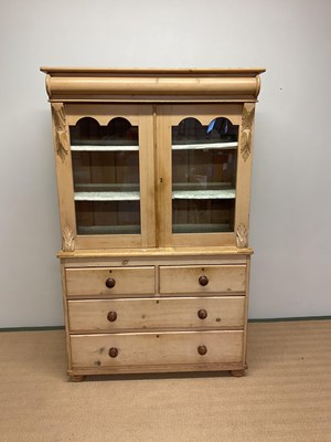 Lot 419 - A stripped pine bookcase on chest with moulded...