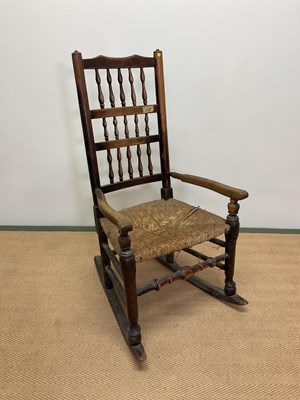 Lot 526 - A 19th century spindle back rush seated...