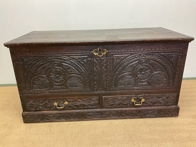 Lot 418 - A carved oak coffer with two drawers to the...