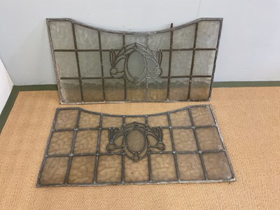 Lot 368 - A pair of shaped rectangular leaded glass...