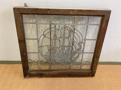 Lot 369 - A leaded glass window decorated with a galleon...