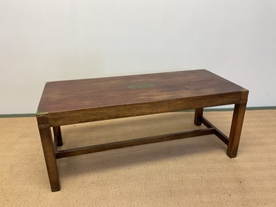 Lot 470 - A mahogany coffee table with brass corners and...