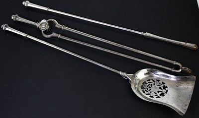 Lot 6357 - A three piece Georgian style companion set...