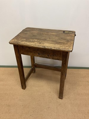 Lot 527 - An oak school desk