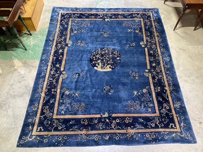 Lot 351 - A circa 1910 blue ground Peking rug with...