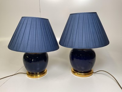 Lot 339 - A near pair of blue glazed globular table...